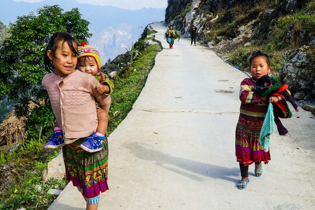 ethnic local kids on the Ma Pi Leng Skywalk in Ha Giang