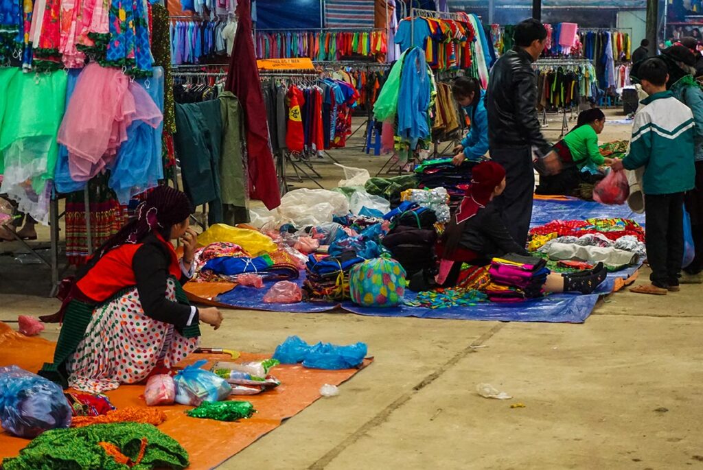ethnic people selling clothes at the Meo Vac Market